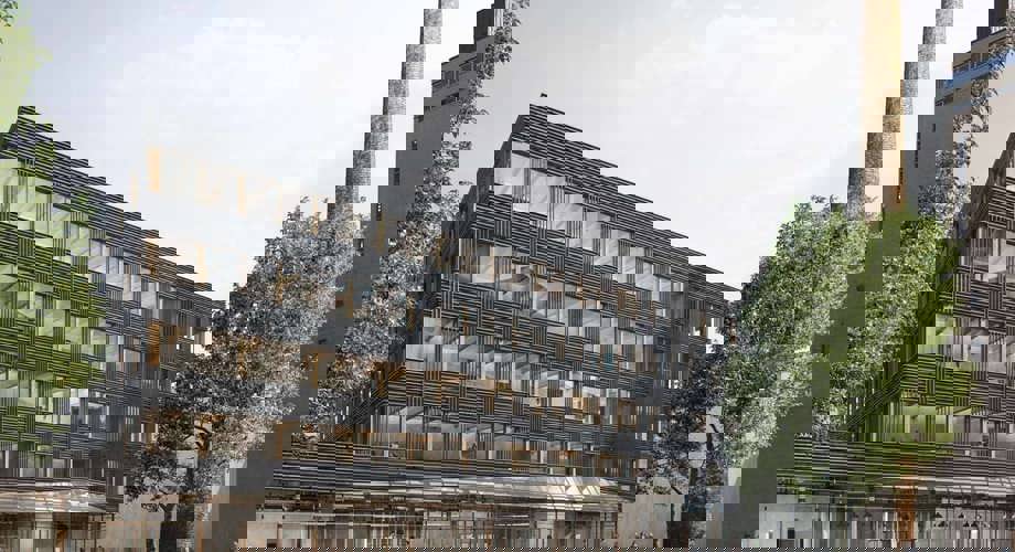 A Fribourg, le projet de développement du quartier d'innovation Blue Factory, avec ses façades en bois brûlé, garde la cheminée historique